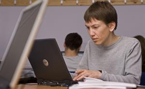 Image of a user on a laptop
