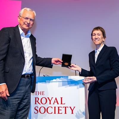 Jacqui Cole being presented her medal at the Royal Society