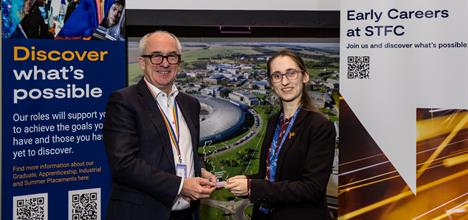 A man handing an award to a young women