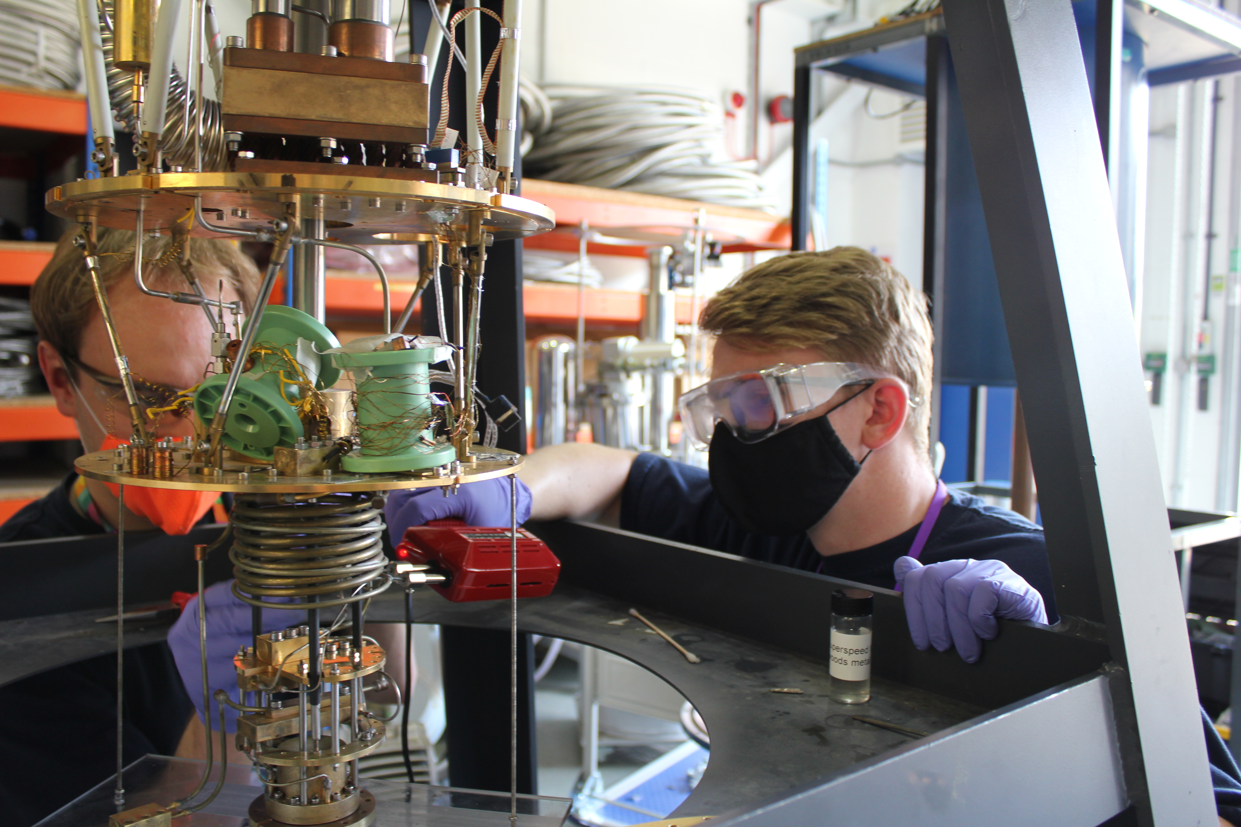 Alex and Ross soldering the dilution fridge pipes