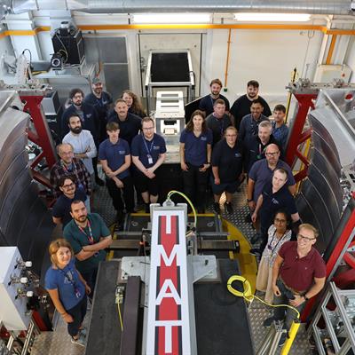 A large group of people stood in the IMAT instrument area