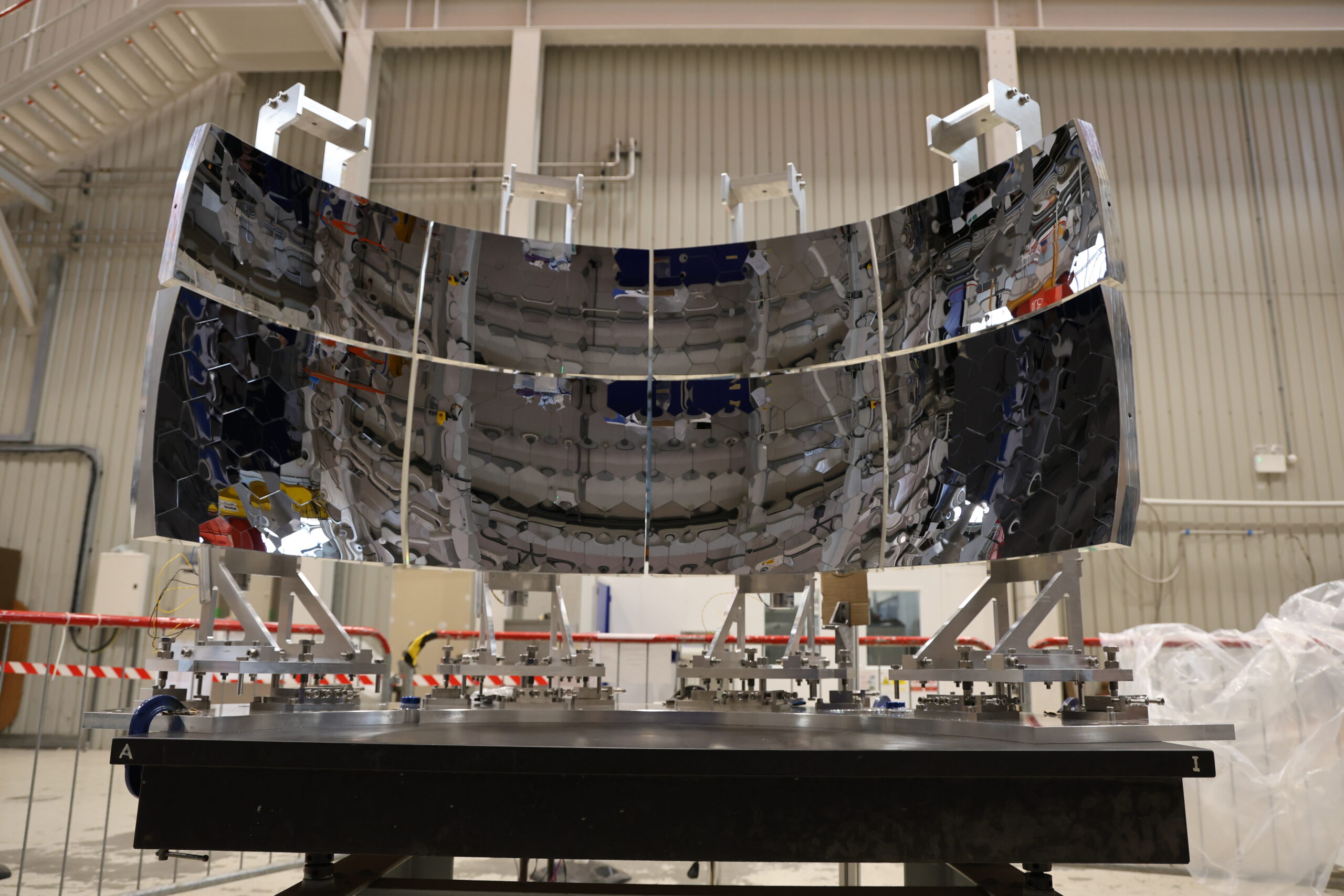 A very shiny, large semicircular piece of equipment