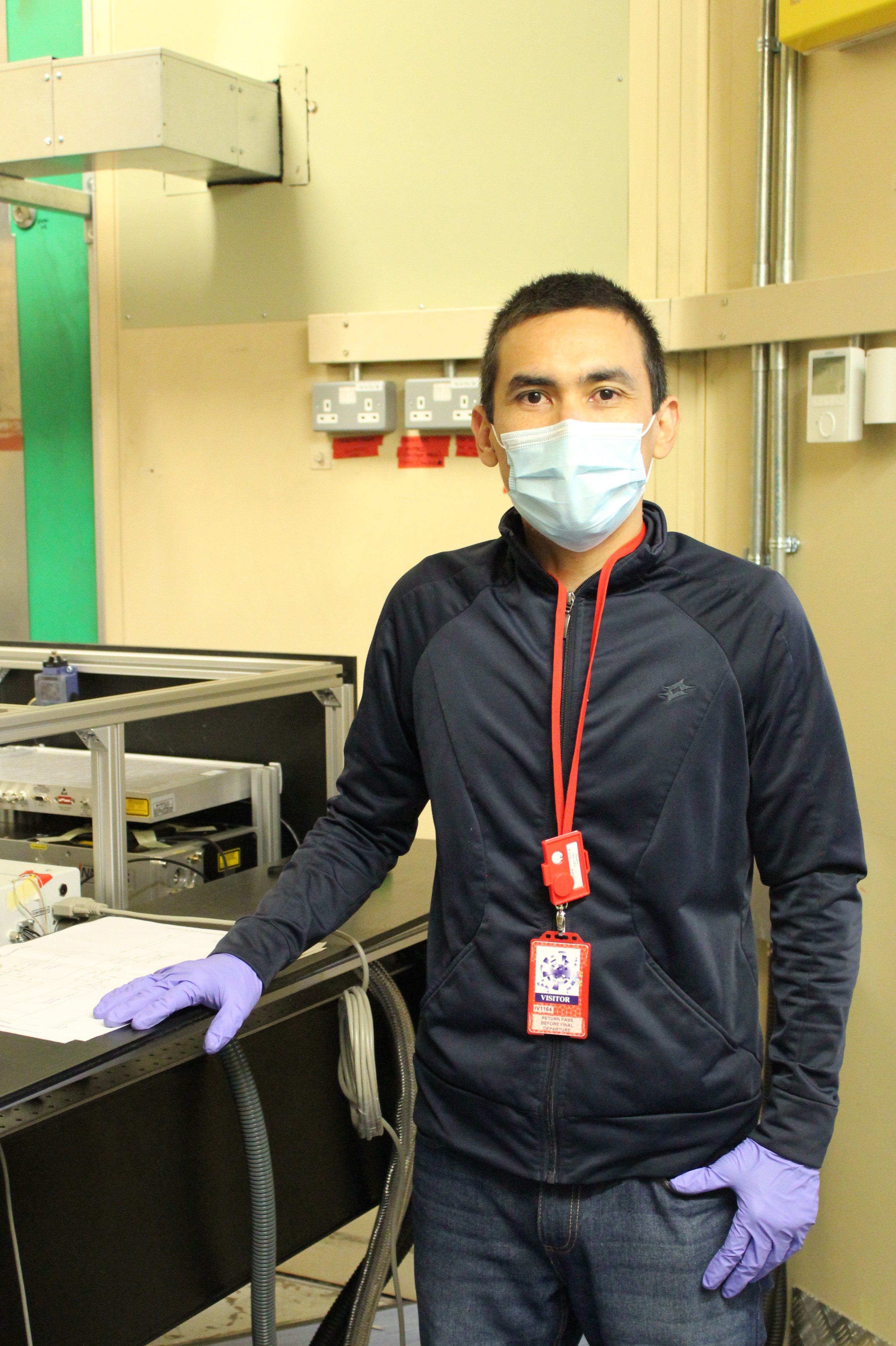 Research Fellow Jose Suarez Vargas next to the laser in RIKEN Port 1