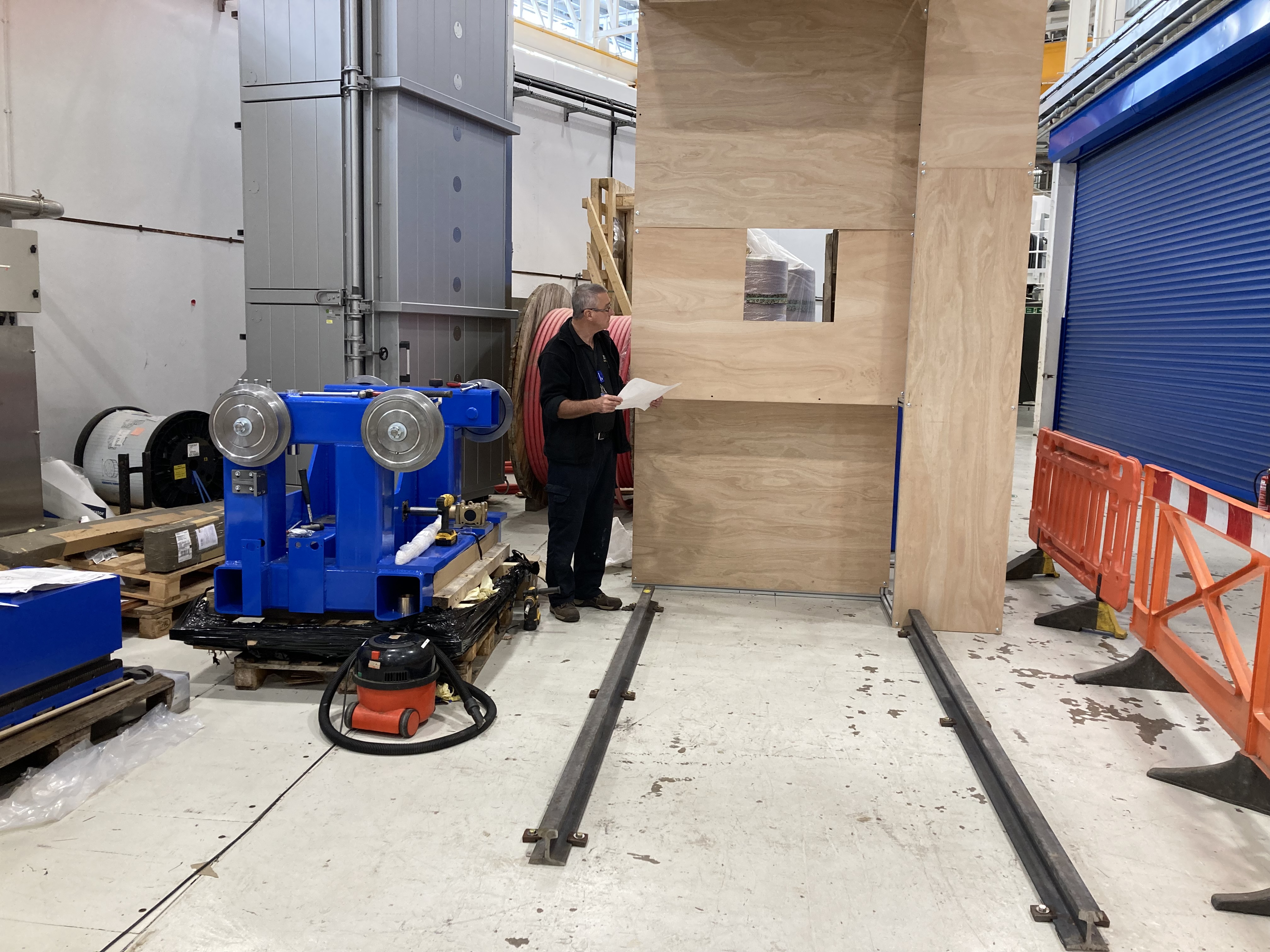 An engineer inspecting the new collimator Mock up