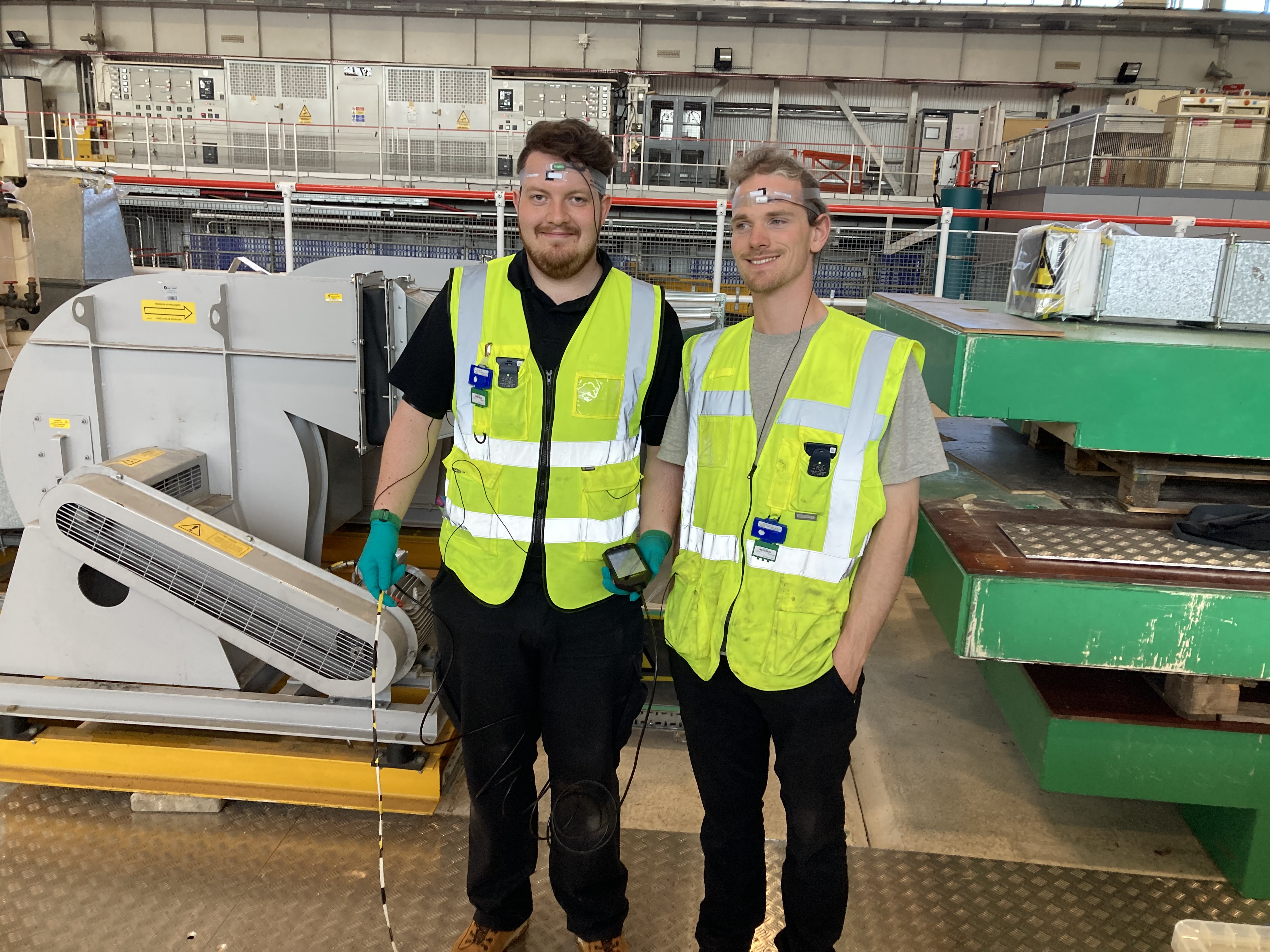 Staff wearing radiation monitors on their foreheads