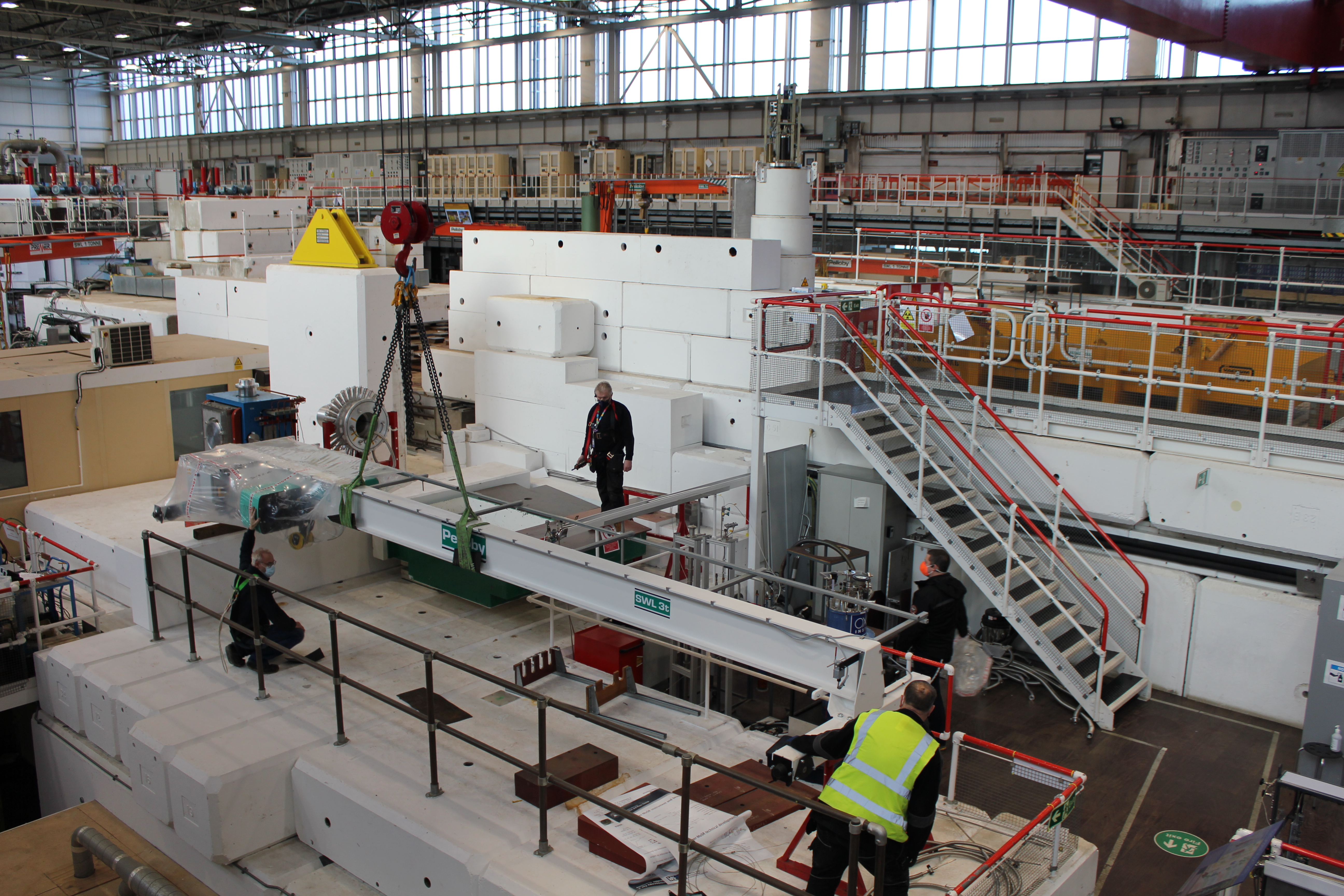 ISIS staff using the large crane to lift the new crane